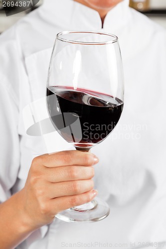 Image of Chef Holding Glass Of Red Wine