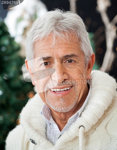 Image of Senior Man In Christmas Store
