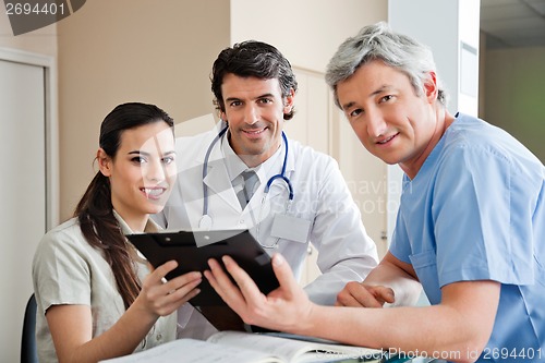 Image of Medical Professionals Standing At Reception