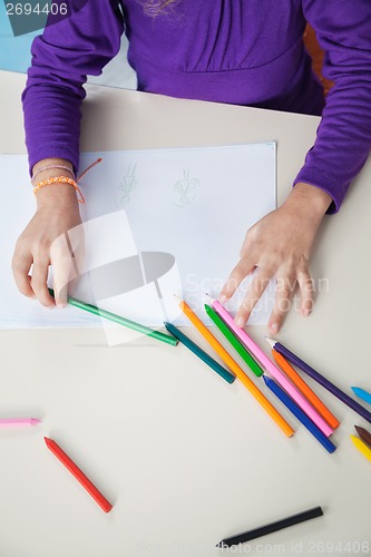 Image of Girl With Color Pencils And Paper At Desk