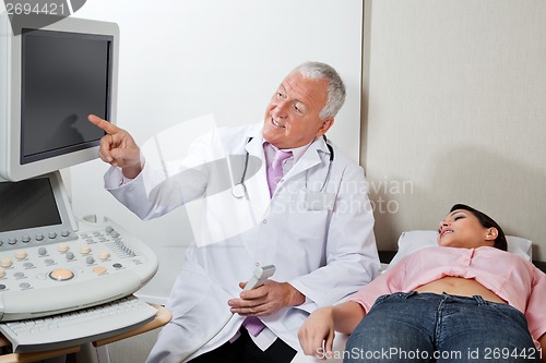 Image of Radiologist With Female Patient At Clinic