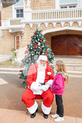 Image of Sant Claus And Girl Looking At Each Other