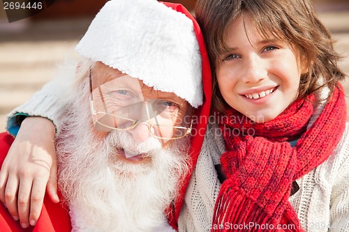 Image of Boy And Santa Claus Smiling