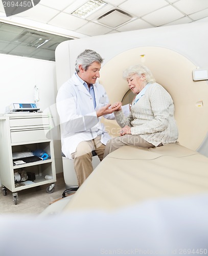 Image of Radiologist Comforting Female Patient