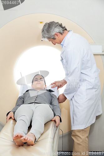 Image of Doctor Preparing Patient For CT Scan Test