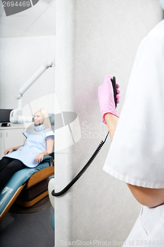 Image of Dentist Conducting Patient's X-Ray Test At Clinic