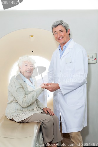 Image of Happy Doctor And Female Patient