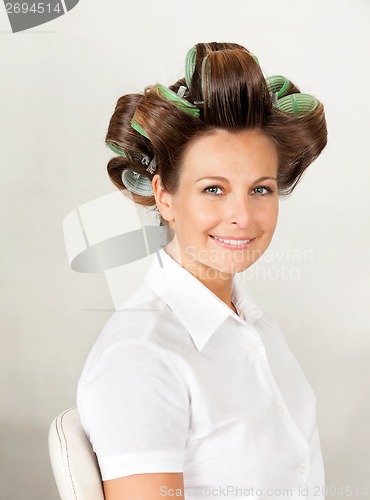 Image of Client With Hair Curlers In Salon