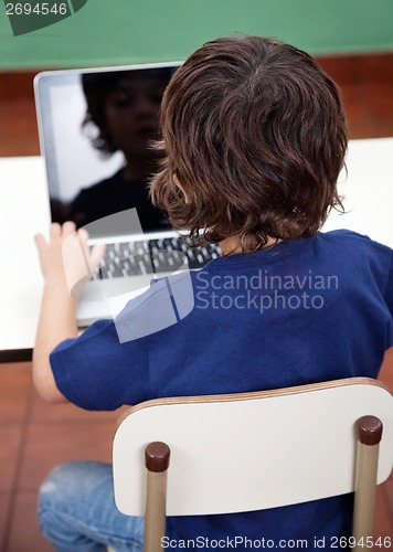 Image of Boy Using Laptop In Kindergarten