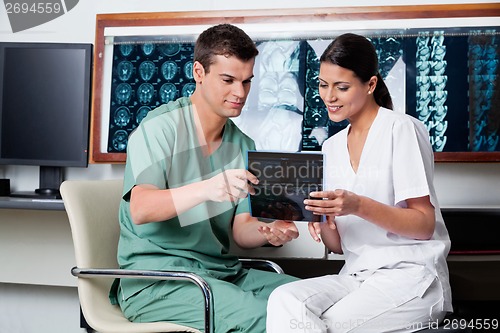 Image of Medical Technicians Looking At X-ray