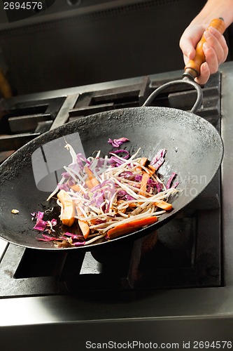 Image of Chef Cooking Vegetables In Wok