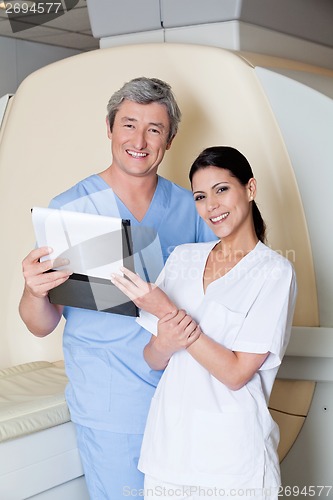 Image of Technicians Holding Clipboard