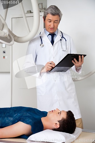 Image of Radiologist With Patient At Clinic