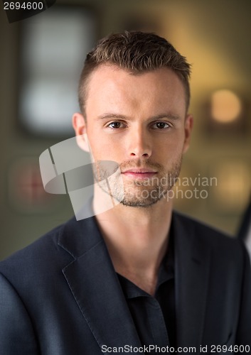 Image of Handsome Businessman At Coffeeshop