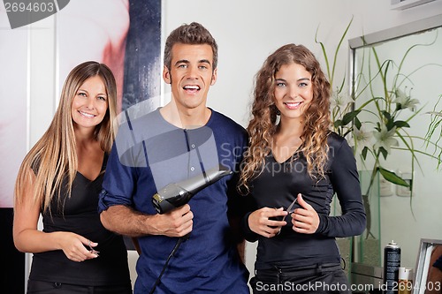 Image of Happy Hairstyling Team At Beauty Parlor