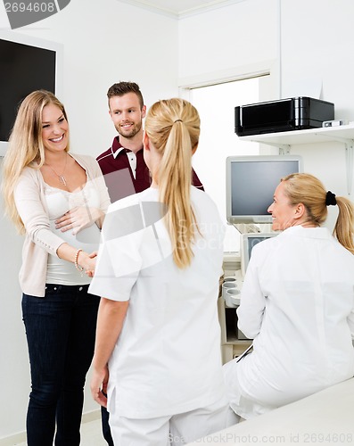 Image of Expectant Couple Visiting Gynecologist