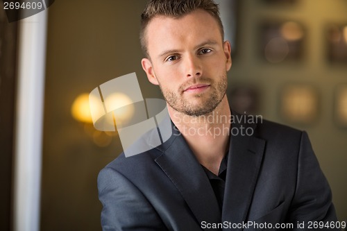 Image of Young Businessman At Coffeeshop