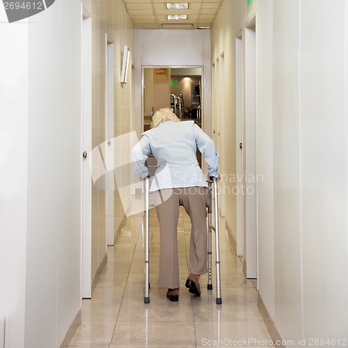 Image of Woman With Walker In Corridor