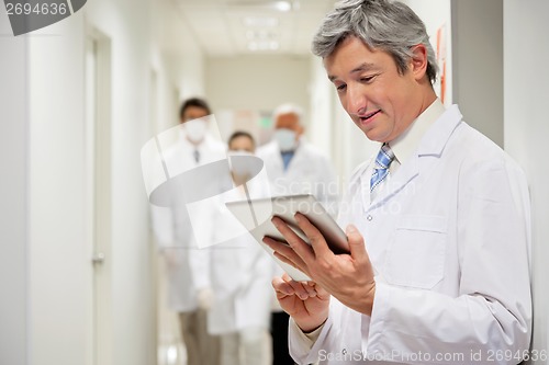 Image of Doctor Holding Digital Tablet