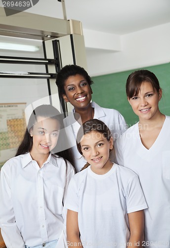 Image of Teacher Standing With Female Students