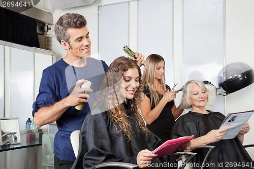 Image of Hairdressers Setting Up Client's Hair In Salon
