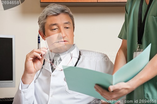 Image of Doctor Reading Patient's File