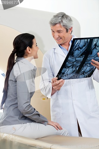 Image of Radiologist Looking At Female Patient