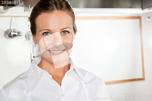 Image of Happy Female Chef In Kitchen