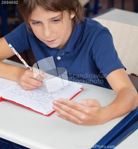 Image of Schoolboy Cheating During Examination