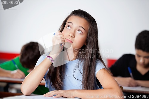 Image of Thoughtful Teenage Schoolgirl Looking During Examination