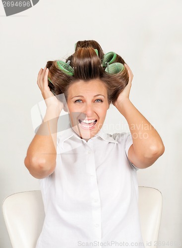 Image of Female Customer With Curls In Hair Shouting