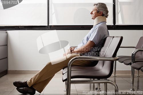 Image of Man With Neck Injury Waiting In Lobby