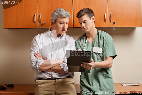 Image of Patient With Technician At Clinic