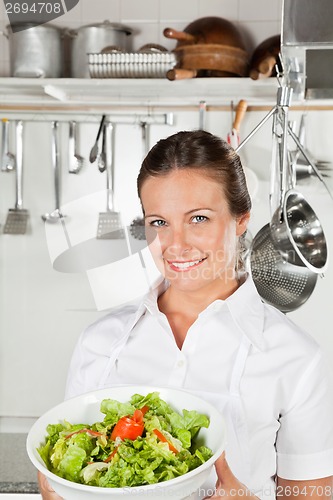 Image of Female Chef Holding Bowl Of Salad