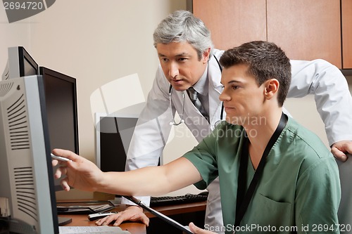 Image of Doctor And Technician Working Together