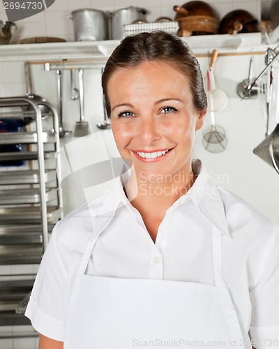 Image of Happy Female Chef In Kitchen