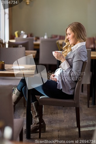 Image of Pregnant Woman Having Coffee