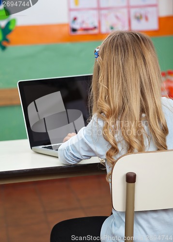 Image of Little Girl Using Laptop In Preschool