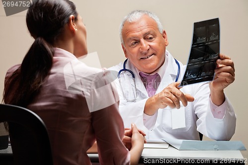 Image of Radiologist Explaining X-ray To Patient