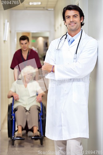 Image of Doctor With Patient And Male Technician