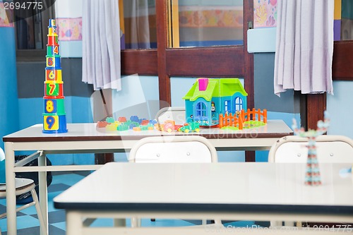 Image of Construction Blocks And House On Desk