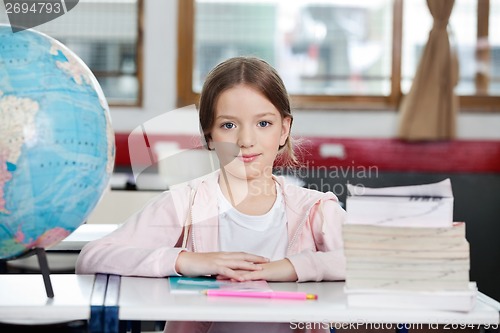 Image of Schoolgirl Sitting At Desk