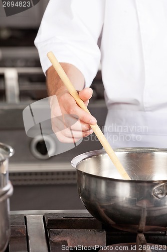 Image of Male Chef preparing Food