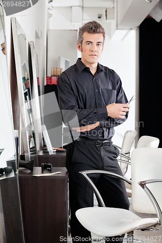 Image of Confident Male Hairdresser With Scissors At Salon
