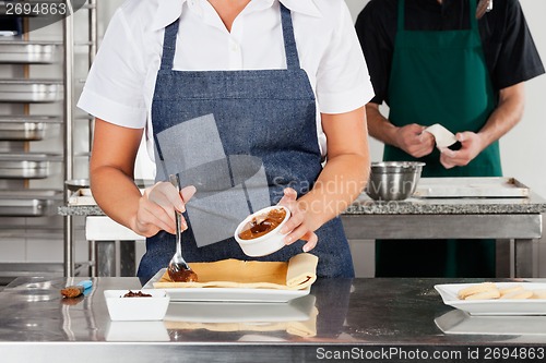 Image of Chef Preparing Chocolate Roll