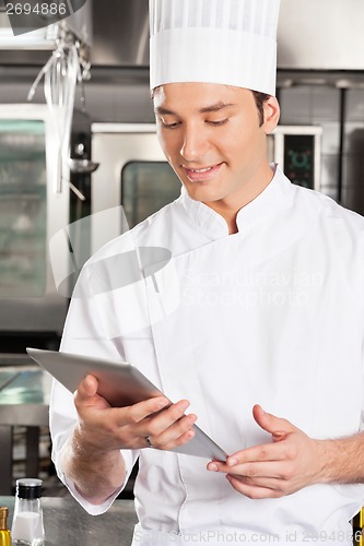 Image of Chef Using Digital Tablet
