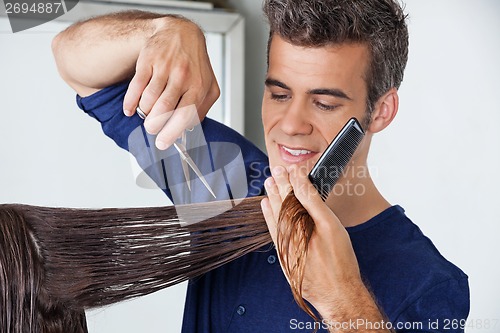 Image of Hairdresser Cutting Client's Hair