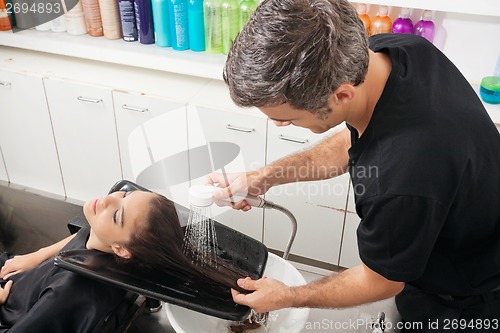 Image of Hairdresser Washing Client's Hair