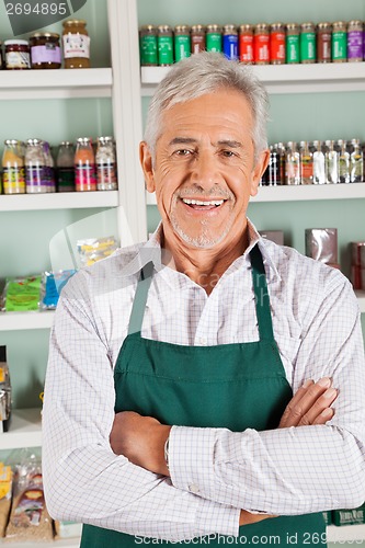 Image of Confident Male Owner Standing In Grocery Store