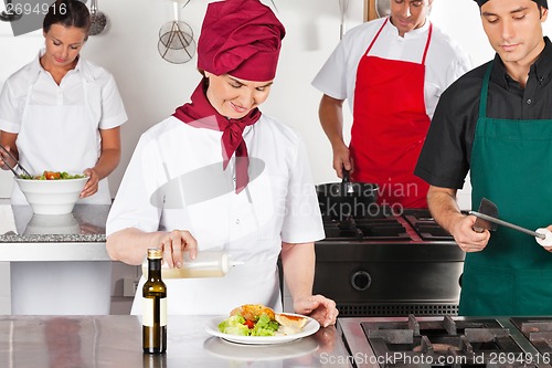 Image of Chefs Working In Kitchen